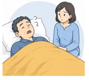 眠る夫のいびきを心配する妻